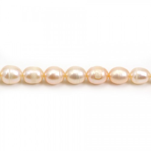 Salmon color oval freshwater pearls on thread 7-10mm x 40cm