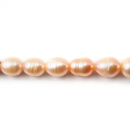Perles d'eau douce ovales couleur saumon sur fil 6-6.5mm x 40cm