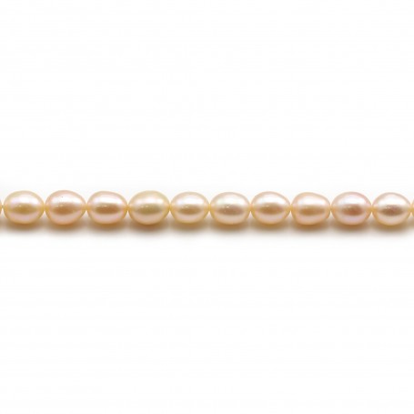 Salmon color oval freshwater pearls on thread5-6mm x 40cm