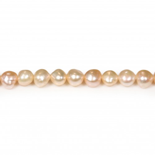 Salmon color baroque freshwater pearls on thread 6-7mm x 35cm