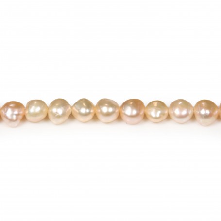 Salmon color baroque freshwater pearls on thread 6-7mm x 35cm