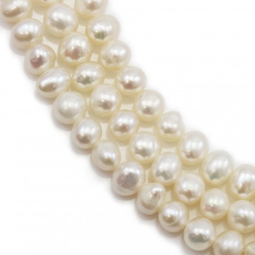 White oval freshwater pearls on thread 4-5mm x 40cm